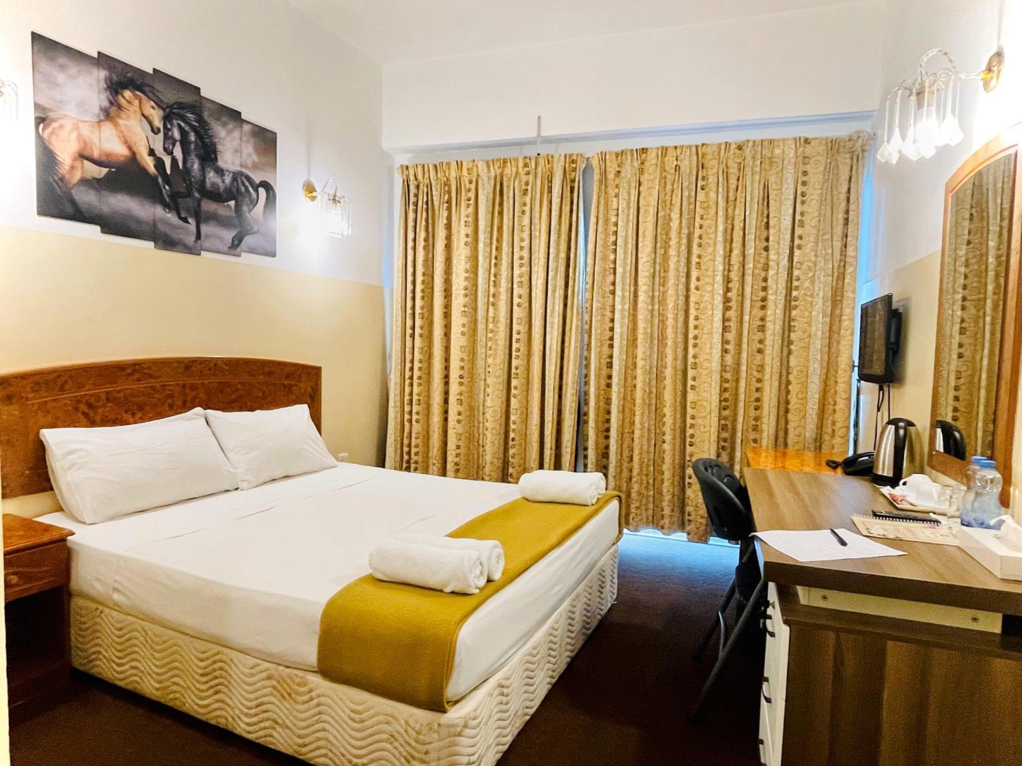 Queens Next Sabkha Bus Station Hotel